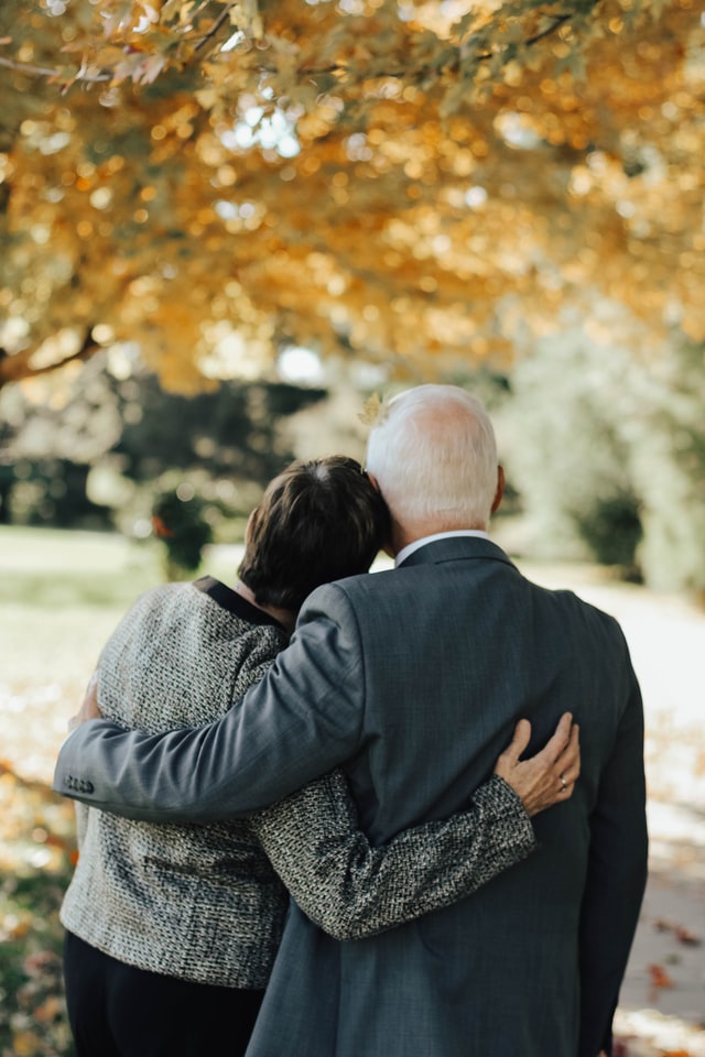 A couple with their hands together