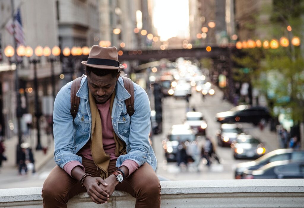 Man sitting on his own reflecting